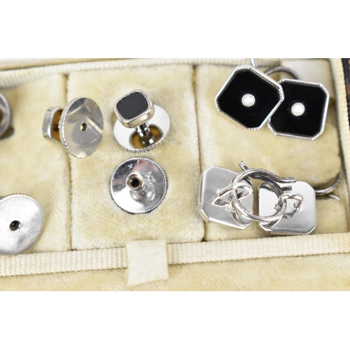 494 - A set of Art Deco black 9ct white gold, black enamel and seed pearl cufflinks, buttons and shirt stu... 