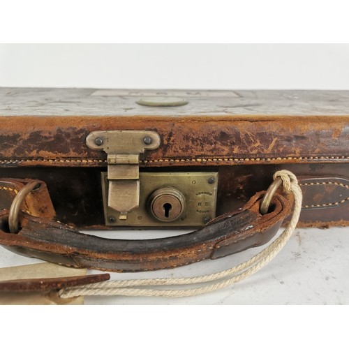 429 - A brass-bound leather gun case by Holland & Holland, London, for hammerless ejector gun, the case of... 