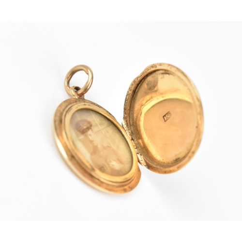 431 - A collection of three gold photo lockets, comprising a circular one with engine turned design, stamp... 