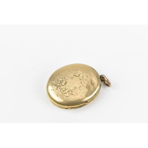 431 - A collection of three gold photo lockets, comprising a circular one with engine turned design, stamp... 