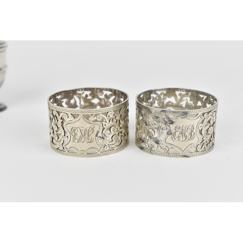 438 - A small collection of silver, to include an Edwardian silver milk jug, a pair of Victorian pepper po... 