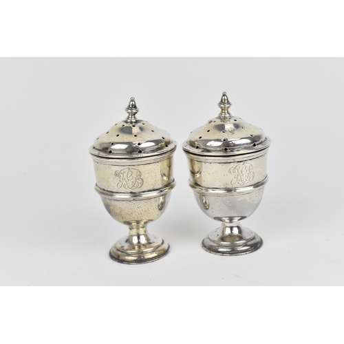 438 - A small collection of silver, to include an Edwardian silver milk jug, a pair of Victorian pepper po... 