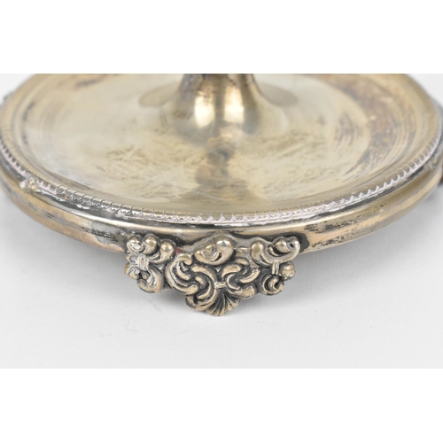 440 - An Italian silver chamberstick, with c-scroll and leaf cast nozzle, fluted capital and moulded shell... 