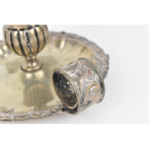 440 - An Italian silver chamberstick, with c-scroll and leaf cast nozzle, fluted capital and moulded shell... 