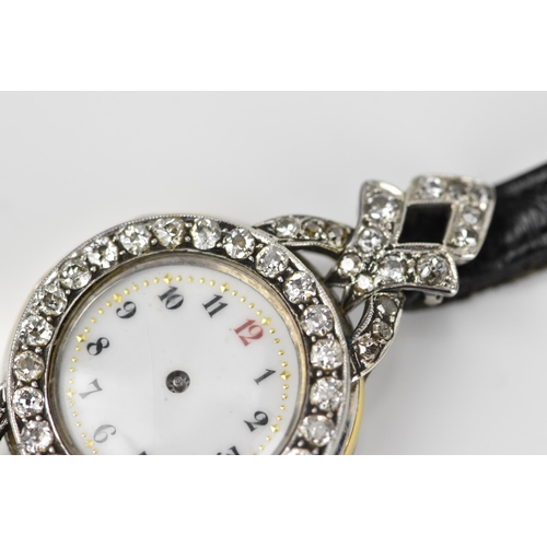 443 - An 18ct white gold and diamond ladies cocktail watch, the white enamel face with Arabic numerals set... 