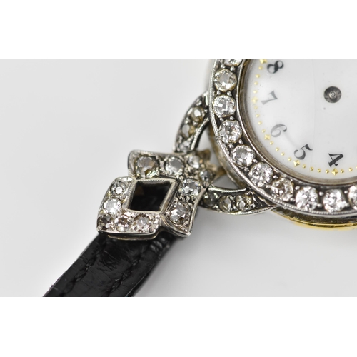 443 - An 18ct white gold and diamond ladies cocktail watch, the white enamel face with Arabic numerals set... 