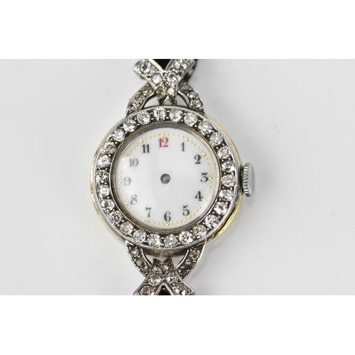 443 - An 18ct white gold and diamond ladies cocktail watch, the white enamel face with Arabic numerals set... 