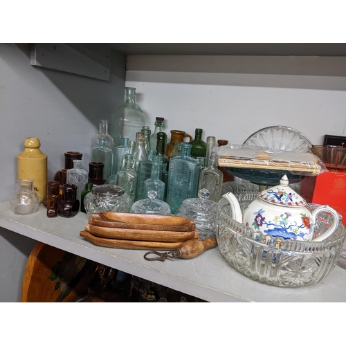 413 - A mixed lot to include glass and stoneware bottles, oval mirror, Booths teapot, wash jug, pictures a... 