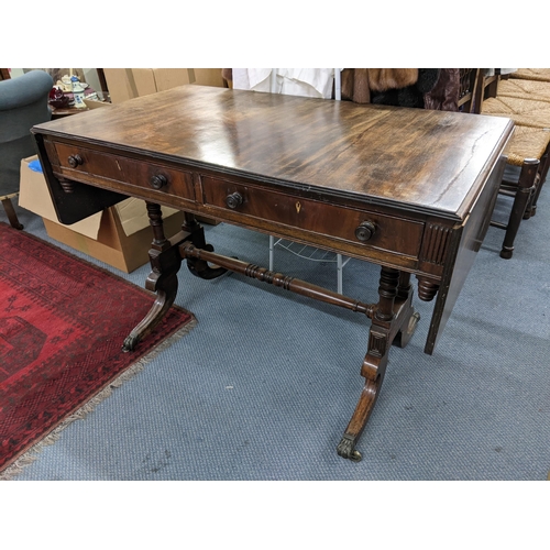 469 - A Regency mahogany sofa table having two drawers, turned supports and on four splayed legs, 73.5cm h... 