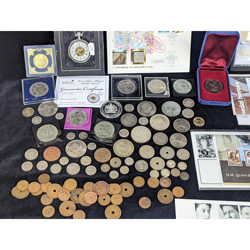 496 - A group of mixed coinage and First Day covers to include a selection of Rhodesian coins, commemorati... 