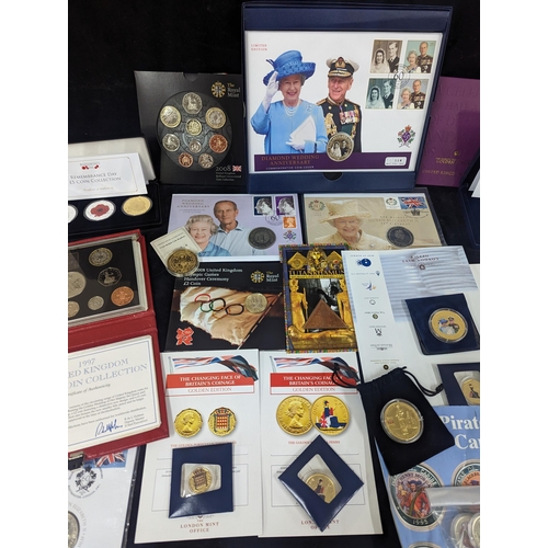 486 - A mixed lot of commemorative coins to include crowns, First day covers, the 2007 Diamond Wedding 5oz... 