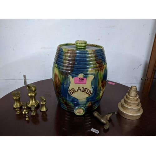 500 - An early 20th century multi coloured stoneware brandy barrel and white painted metal scales Location... 