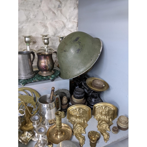 519 - A mixed lot of metalware to include a post-war turtle helmet Mk 4, cast iron and brass scales with w... 