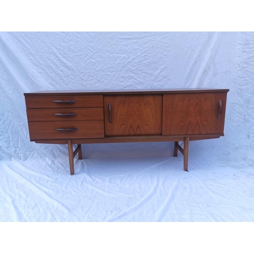 112 - A retro Avalon teak sideboard, designed with by two sliding doors and three left side drawers with m... 