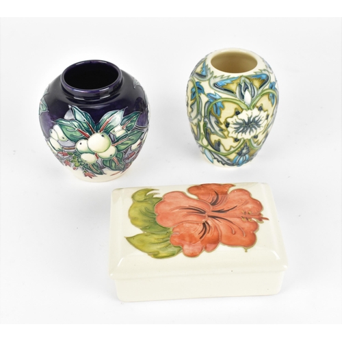 96 - A small collection of Moorcroft pottery, to include two vases and a lidded box, one vase by Nicola S... 