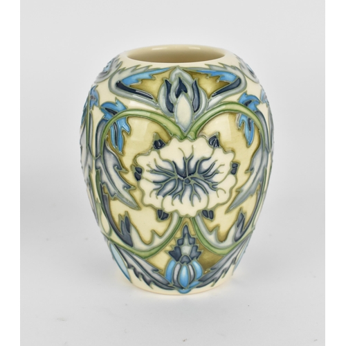 96 - A small collection of Moorcroft pottery, to include two vases and a lidded box, one vase by Nicola S... 