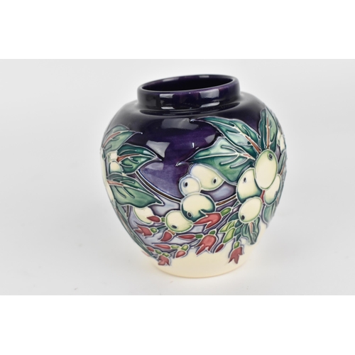 96 - A small collection of Moorcroft pottery, to include two vases and a lidded box, one vase by Nicola S... 