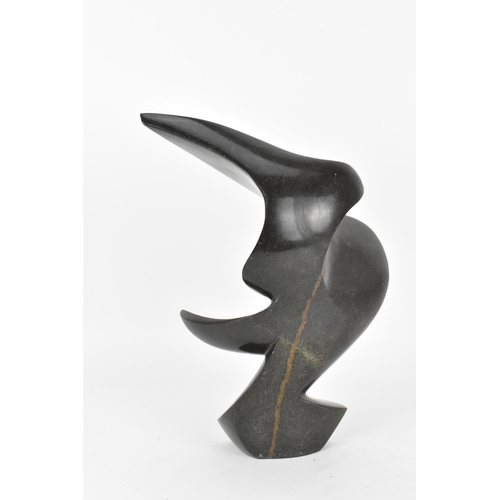 88 - A contemporary Zimbabwean shona sculpture, modelled as an abstract wave, signed to the back of the b... 