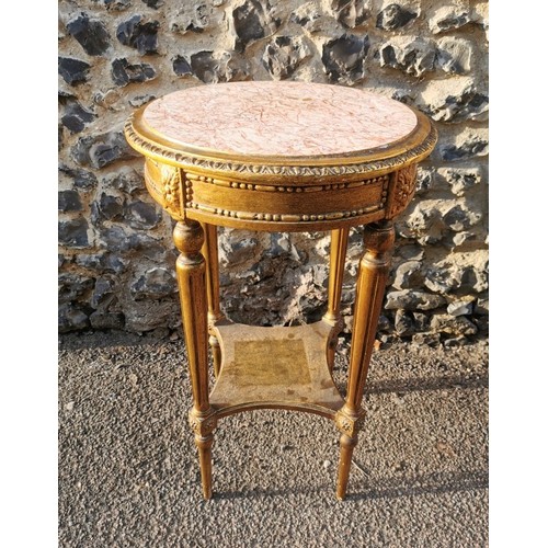 303 - A French Louis XVI style giltwood and marble side table, the circular top inset with pink breche mar... 