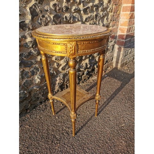 303 - A French Louis XVI style giltwood and marble side table, the circular top inset with pink breche mar... 