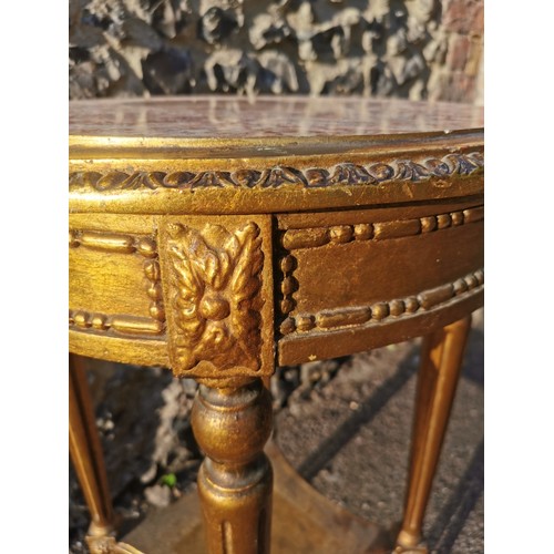 303 - A French Louis XVI style giltwood and marble side table, the circular top inset with pink breche mar... 