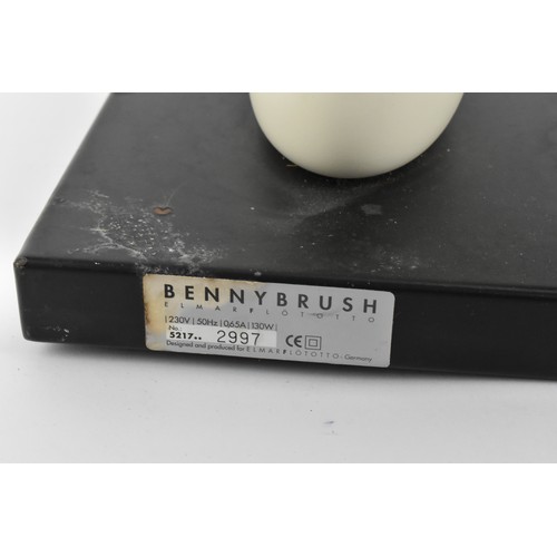 53 - A 20th century German 'Benny Brush' shoe polisher by Elmar Flötotto, with a cream body and wagging t... 