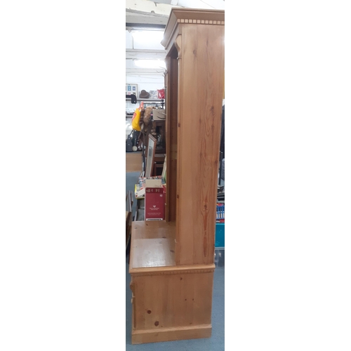 107 - A modern pine bookcase with three removeable shelves and shelf and single drawer below 190cm h x 74c... 