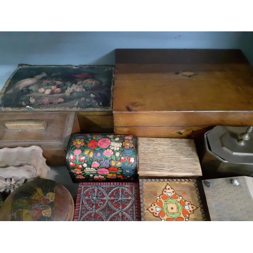 98 - A quantity of treen boxes to include papermache Victorian writing boxes and musical boxes together w... 