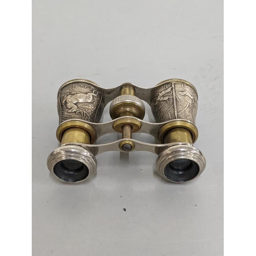 94 - A pair of French hunting binoculars cast depicting a stag and dogs together with a pair of leather c... 