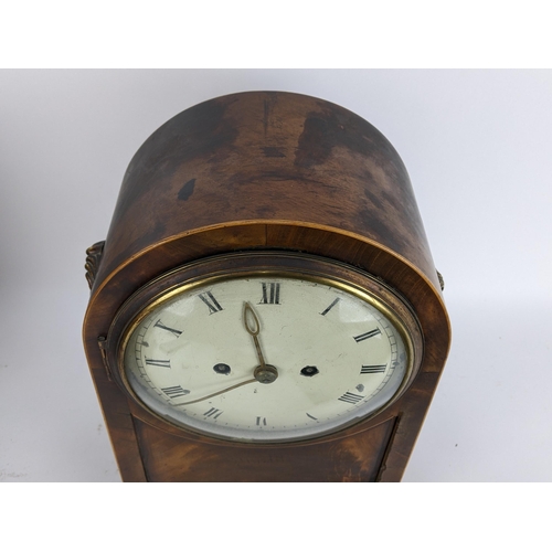 10 - A Regency mahogany bracket clock having an arched top case with boxwood string inlaid, two ring hand... 
