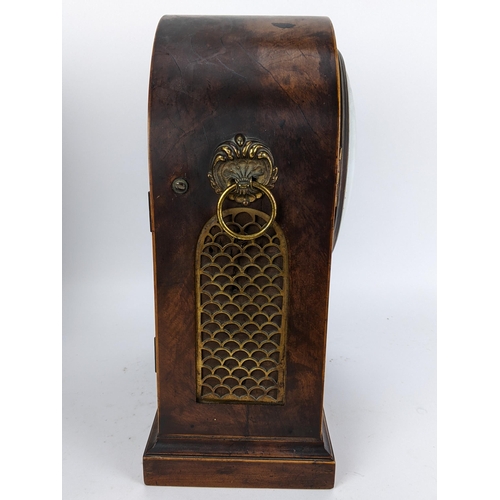 10 - A Regency mahogany bracket clock having an arched top case with boxwood string inlaid, two ring hand... 