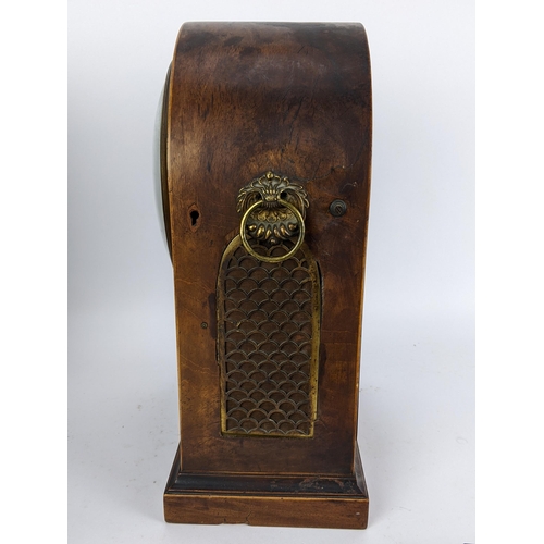 10 - A Regency mahogany bracket clock having an arched top case with boxwood string inlaid, two ring hand... 