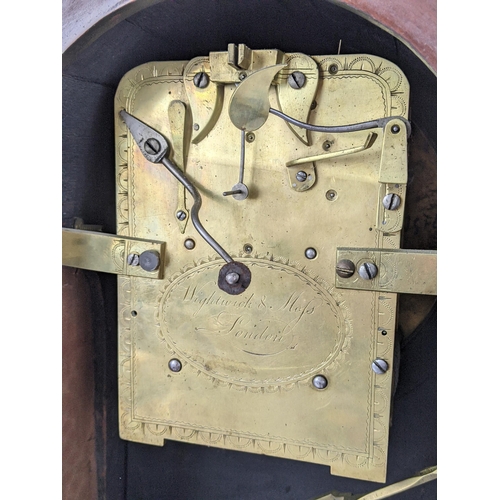 10 - A Regency mahogany bracket clock having an arched top case with boxwood string inlaid, two ring hand... 