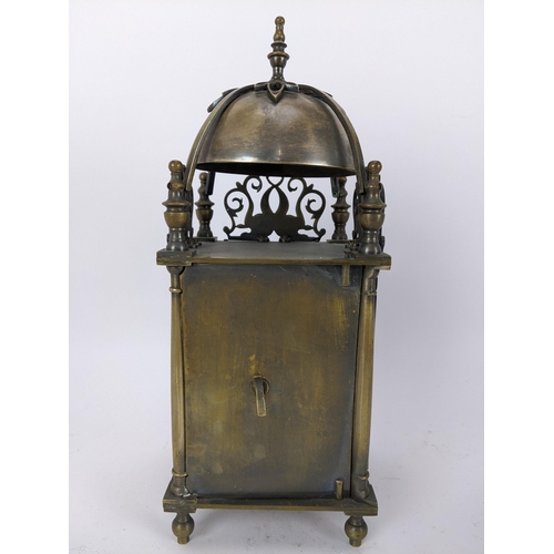 14 - An early 20th century brass lantern clock, in the 18th century style the four post case with 5