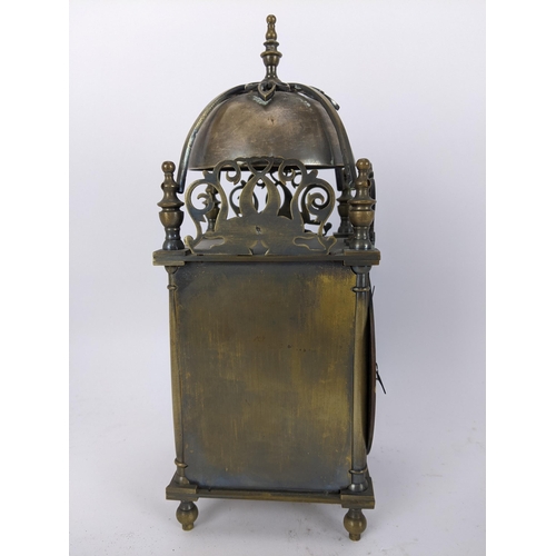 14 - An early 20th century brass lantern clock, in the 18th century style the four post case with 5