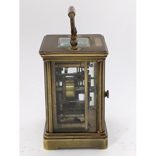 17 - A 19th century French brass miniature carriage alarm clock, the white enamel dial having black Roman... 