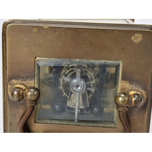 17 - A 19th century French brass miniature carriage alarm clock, the white enamel dial having black Roman... 