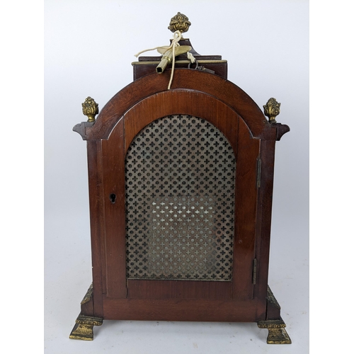 18 - A late 19th/early 20th century mahogany bracket clock, the case having basket of flowers finials, gi... 