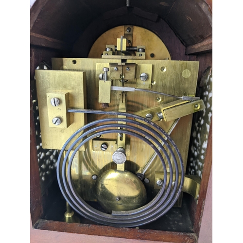 18 - A late 19th/early 20th century mahogany bracket clock, the case having basket of flowers finials, gi... 