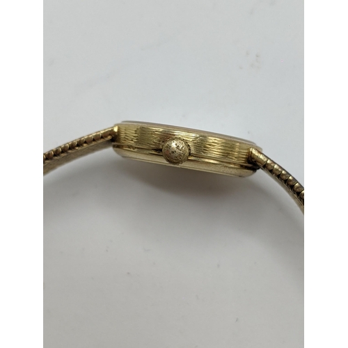 21 - A Omega manual wind ladies 14ct gold wristwatch, circa 1973, having a gilt dial with Arabic numerals... 