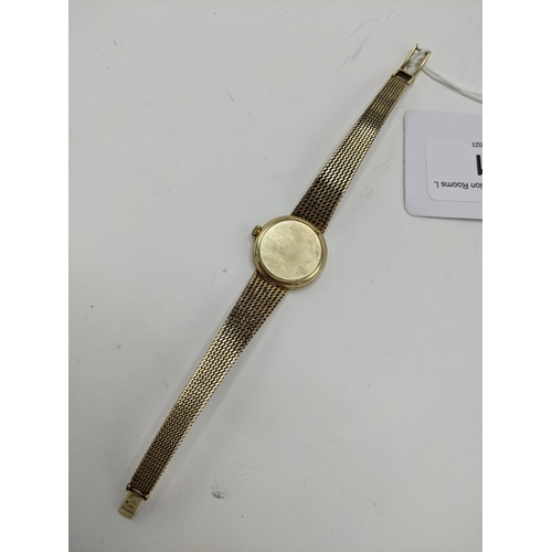 21 - A Omega manual wind ladies 14ct gold wristwatch, circa 1973, having a gilt dial with Arabic numerals... 