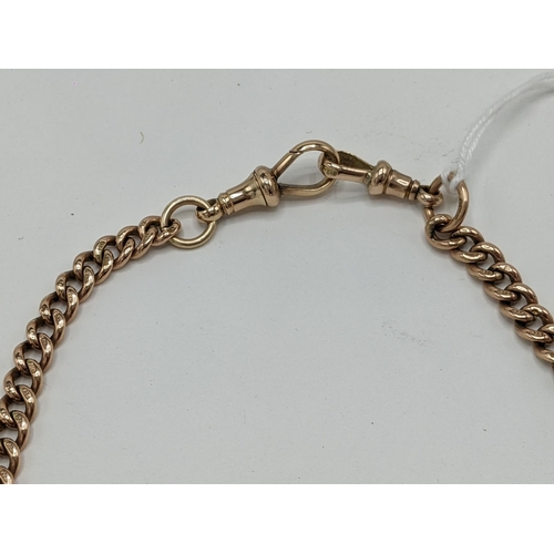 23 - A 9ct rose gold curb link pocket watch chain with a 9ct dog clip and a 15ct dog clip, 43cm long, 29 ... 