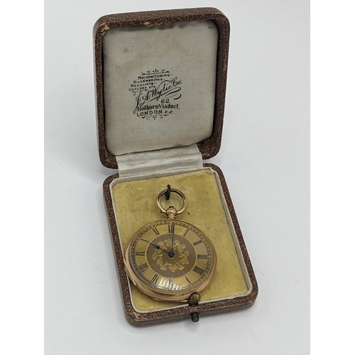24 - A Victorian 14ct gold, open faced fob watch, having a gilt engraved floral dial, blued hands and Rom... 