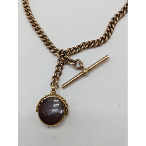 26 - A Victorian 9ct gold Double Albert curb link watch chain having a T-bar and single dog clip, an O ri... 