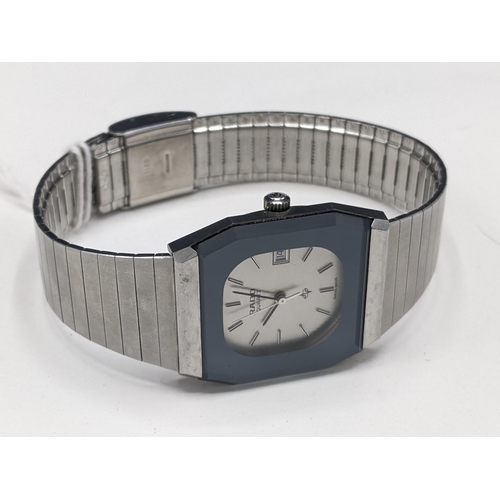 35 - A Rado quartz, stainless steel cased wristwatch, having a silvered dial signed Rado, with centre sec... 