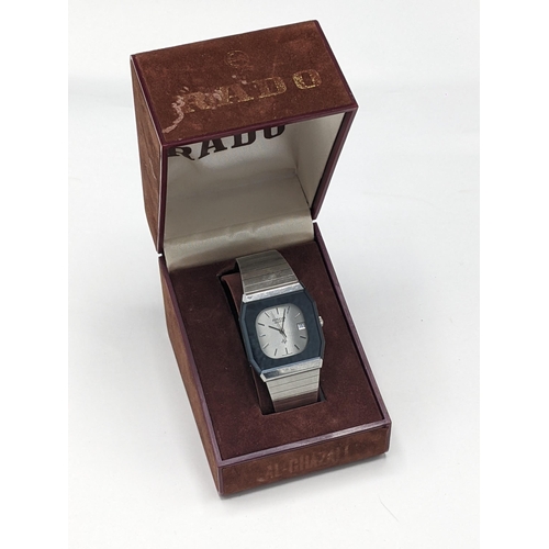35 - A Rado quartz, stainless steel cased wristwatch, having a silvered dial signed Rado, with centre sec... 