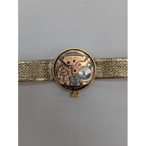 44 - An Omega manual wind, ladies 9ct gold wristwatch, circa 1966, having a silvered dial with baton mark... 
