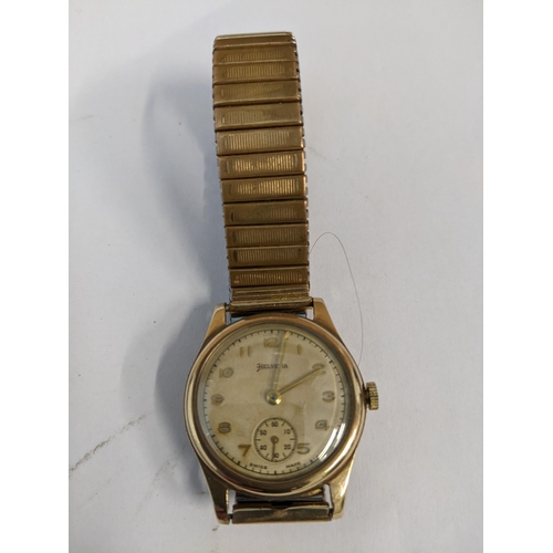 129 - A 1940-50s Helvetia 9ct gold cased hand wound wristwatch (working), dial with gold coloured Arabic n... 