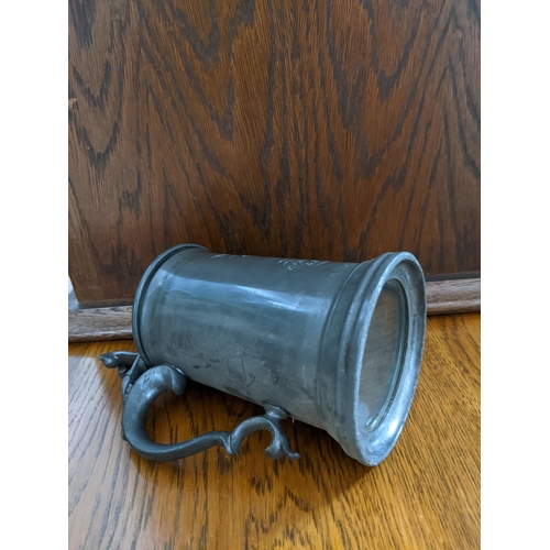 156 - A Victorian glass bottomed pewter presentation rowing trophy tankard for the Winchester College Boat... 