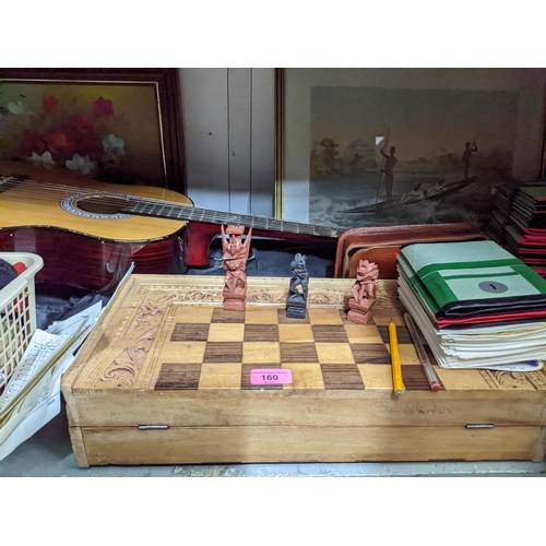 160 - A mixed lot to include a Jose Ferrer El Primo guitar in slip case, a folding box chess set with carv... 